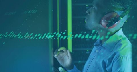 Technician interacting with digital data streams in modern datacenter