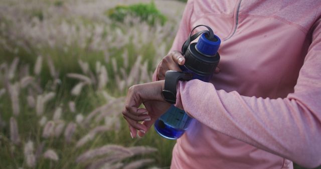 Woman Monitoring Fitness Tracker During Outdoor Workout - Download Free Stock Images Pikwizard.com