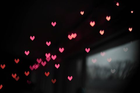 Romantic heart-shaped bokeh with pink and red lights
