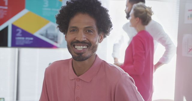 Portrait of happy biracial businessman over diverse colleagues in office - Download Free Stock Photos Pikwizard.com