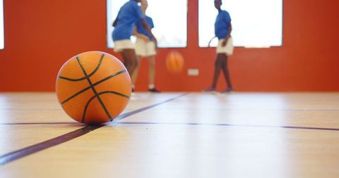 Youthful energy: children engaging in indoor basketball activity
