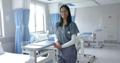 Smiling medical professional in hospital ward