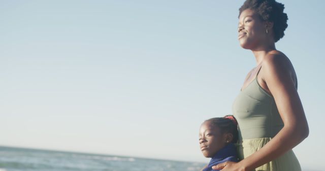Mother and Daughter Enjoying Peaceful Day by Ocean - Download Free Stock Images Pikwizard.com