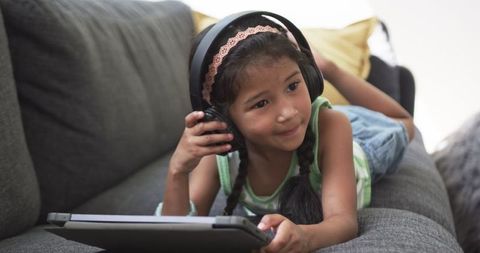 Young Girl Engrossed in Digital Learning on Tablet - Download Free Stock Images Pikwizard.com