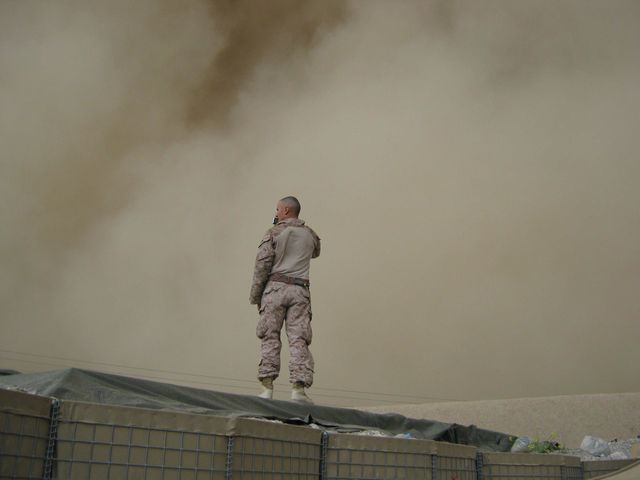 Soldier Standing in Desert Dust Storm - Download Free Stock Photos Pikwizard.com