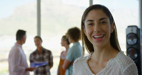 Confident female business executive in modern office setting