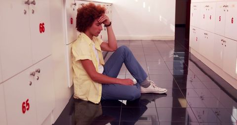Young Man Reflecting in School Corridor by Lockers - Download Free Stock Images Pikwizard.com