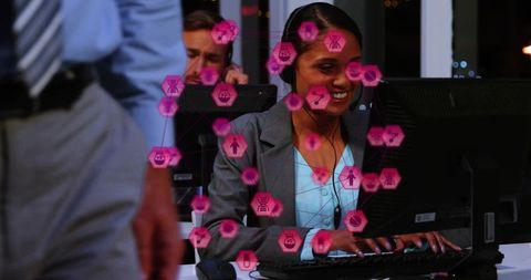Smiling Call Center Agent Working Night Shift with Futuristic Network Overlay on Monitor
