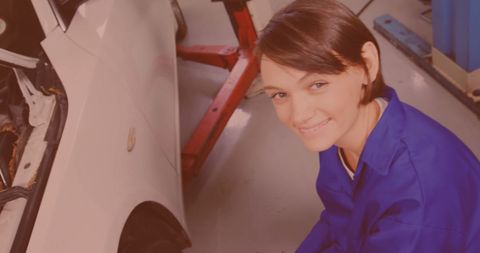 Female Mechanic Servicing Car at Repair Workshop - Download Free Stock Images Pikwizard.com