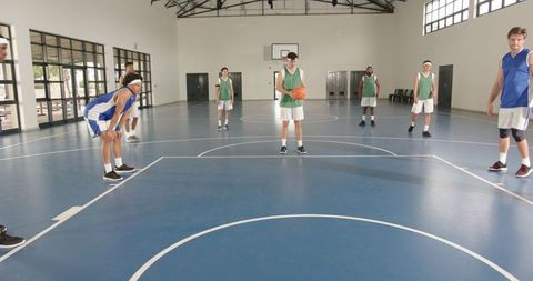 Basketball Players At Free Throw Line in Indoor Gym