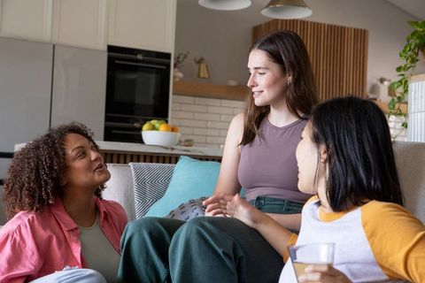 Diverse Women Relaxing at Home Sharing Stories and Laughter