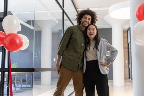 Diverse Coworkers Celebrating in Modern Office Setting