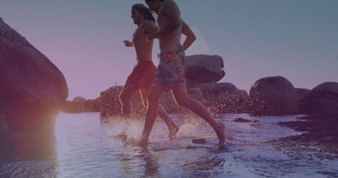 Friends Running on Beach During Sunset