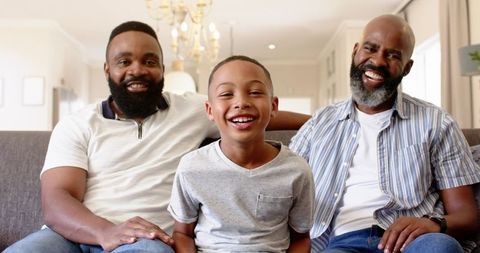 Happy Multigenerational African American Family Smiling on Sofa