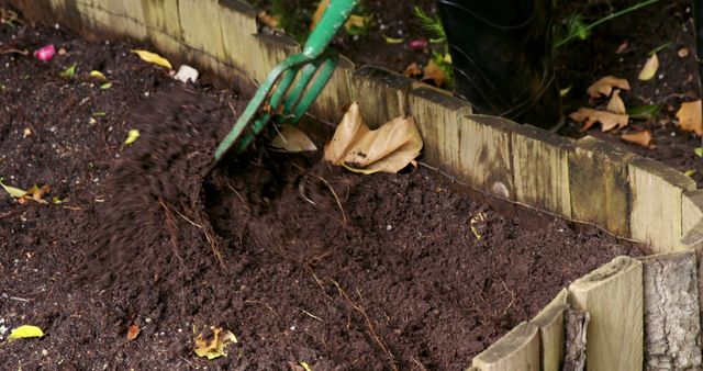 Gardener Tilling Soil in Backyard Garden Bed - Download Free Stock Images Pikwizard.com