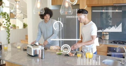 Sunlit modern kitchen breakfast prep by two friends slicing bread and pouring orange juice