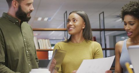 Business Team Holding Documents in Office Discussion