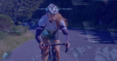 Road cyclist pedaling with live telemetry overlay showing fitness and performance analytics