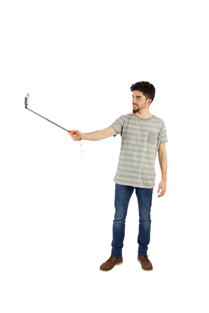 Casual Man Using Transparent Selfie Stick in Studio Setting - Download Free Stock Videos Pikwizard.com