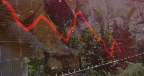 Gardener tending plants with economic trend graph overlay
