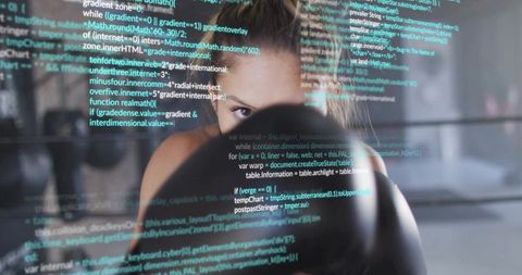 Female boxer training with code overlay, blending fitness and technology for focused strength