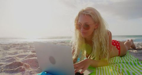 Young Woman in Bikini Typing on Laptop at Sandy Beach - Download Free Stock Images Pikwizard.com