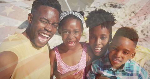 Family Smiling at Beach with American Flag Overlay