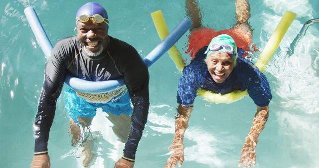 Image of happy senior african american couple swimming in pool - Download Free Stock Photos Pikwizard.com