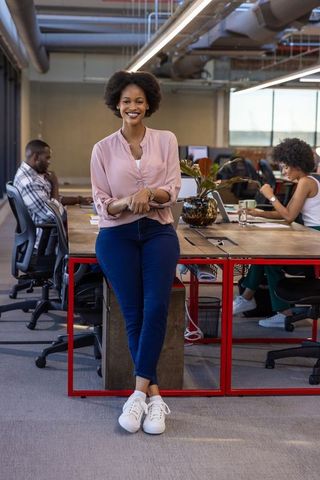 Confident Professional Leading Open-Plan Office Workspace