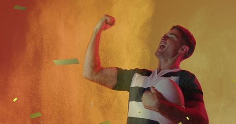 Rugby Player Celebrating amidst Colorful Confetti
