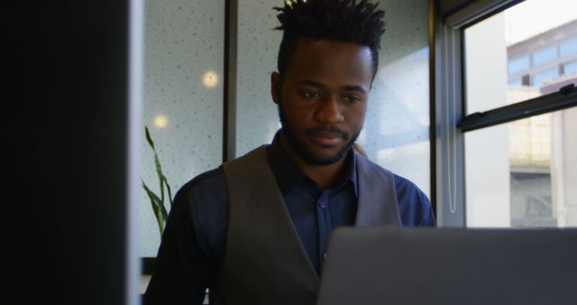 Focused Young Businessman Working on Laptop at Office - Download Free Stock Images Pikwizard.com