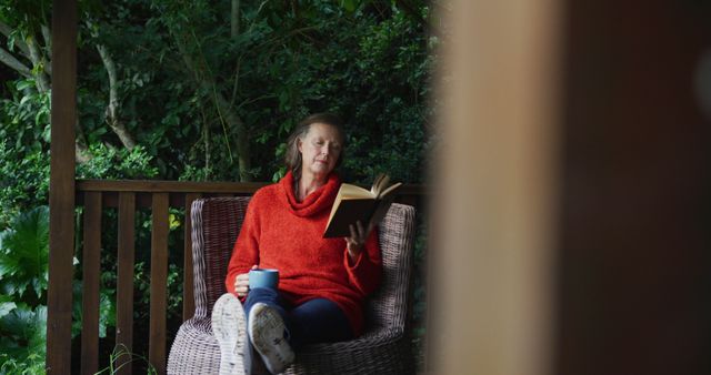 Senior Woman Relaxing in Garden with Book and Coffee - Download Free Stock Images Pikwizard.com