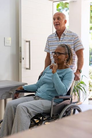 Senior couple navigating home with wheelchair accessibility