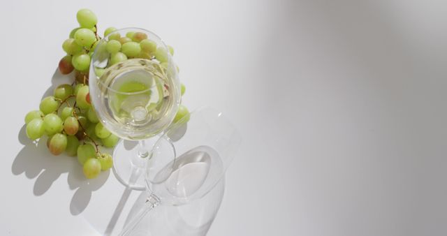 White Wine and Green Grapes on White Table - Download Free Stock Images Pikwizard.com