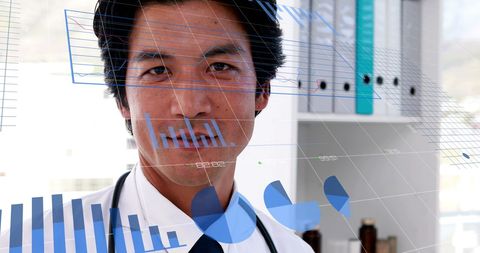 Asian Doctor Analyzing Financial Healthcare Data with Digital Graphs