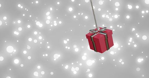 Red Christmas Gift Bauble with Falling Snow Background