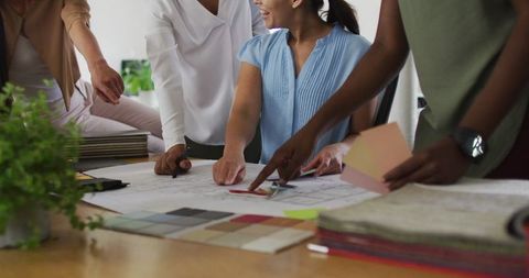 Creative Businesswomen Collaborating on Design Project in Modern Office