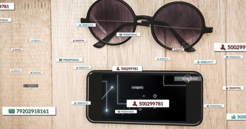 Social media icons with smartphone and sunglasses on table