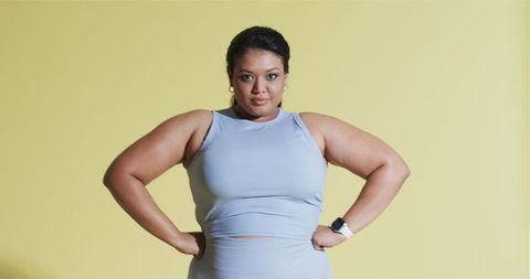Confident Woman in Sportswear Showing Strength and Determination