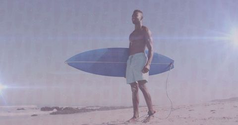 Confident Surfer Standing with Board on Sunny Beach