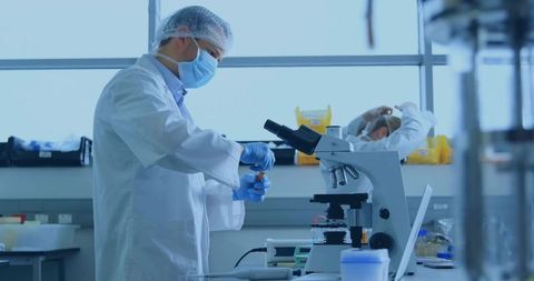 Researcher Conducting Experiment in Laboratory with Advanced Equipment