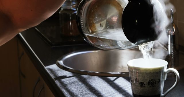 Hands Pouring Hot Water into Coffee Mug in Kitchen - Download Free Stock Images Pikwizard.com