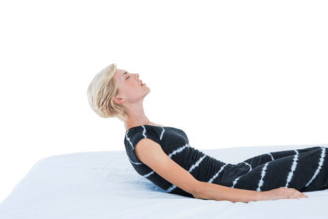 Transparent relaxation: blond woman reclining on bed in casual attire