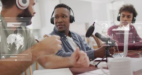 Recording lively podcast conversation with creative team around laptop and mic
