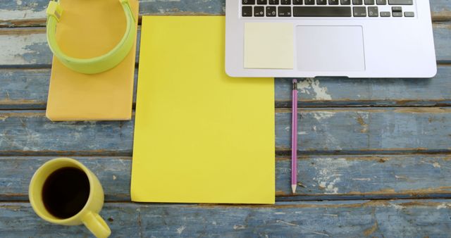 Workspace with Laptop, Coffee, and Stationery on Rustic Blue Wooden Table - Download Free Stock Images Pikwizard.com