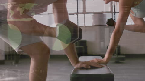 Fit Couple Training with Dumbbells Amid Data Visualization