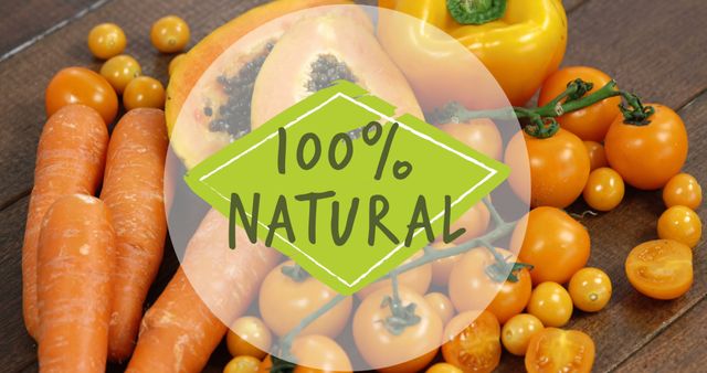 This stock photo shows a selection of 100% natural vegetables and fruits including carrots, papaya, yellow bell peppers, and cherry tomatoes. It emphasizes healthy eating and organic food. Useful for promoting healthy lifestyle, organic food markets, dietary advice, and vegetarian recipes.