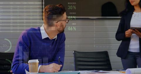 Executives reviewing data analytics in modern boardroom with charts, tablet and documents