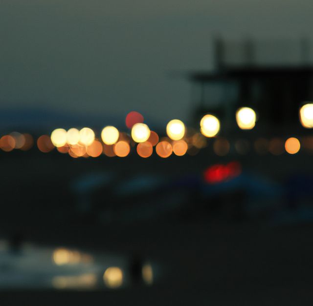 Image of close up of out of focus outdoor lights on beach at night. Lighting, summer and seaside concept.