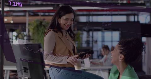 Smiling colleagues sharing phone and coffee in modern open office with purple data overlay